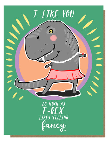 Greeting card with an illustration of a cartoonish T-Rex wearing a pink dress, on a green background. Text reads “I like you as much as T-Rex likes feeling fancy.”